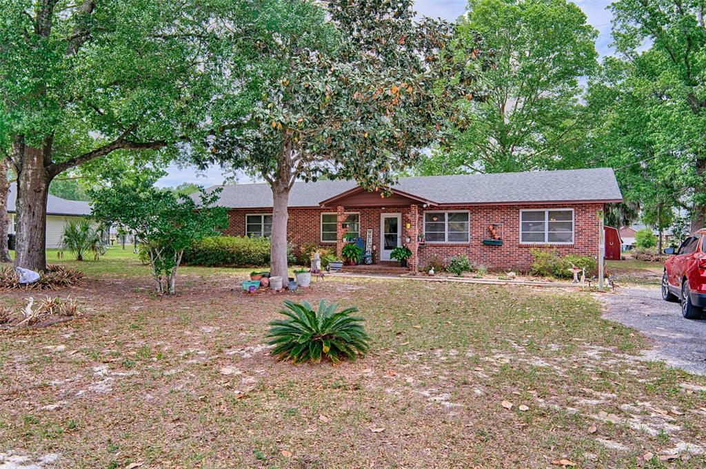 6537 Triest Avenue Keystone Heights, FL 32656 - Photo 35 of 36 a front view of a house with yard patio and green space