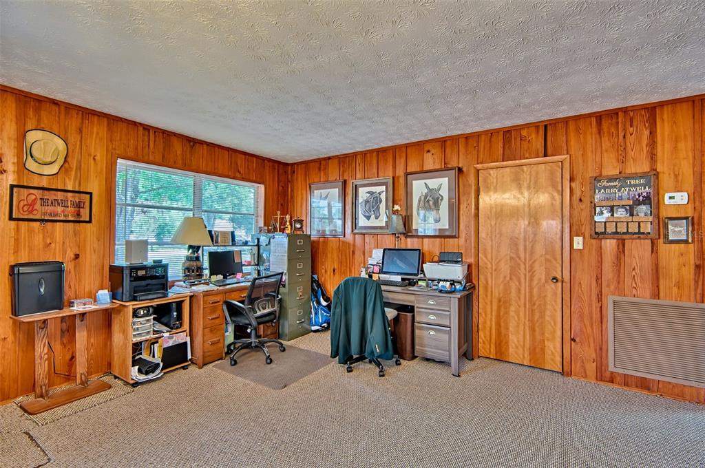6537 Triest Avenue Keystone Heights, FL 32656 - Photo 5 of 36 a view of a room with gym equipment