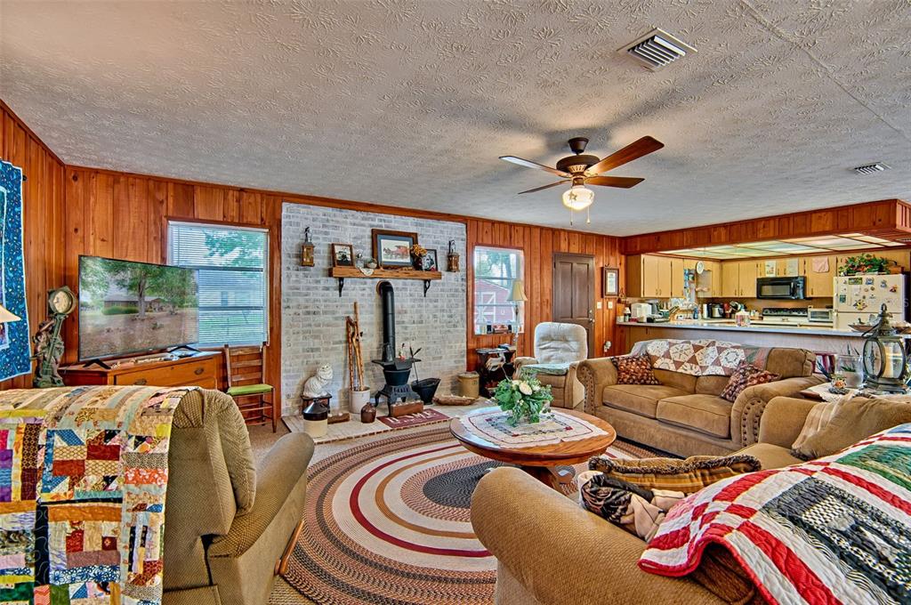 6537 Triest Avenue Keystone Heights, FL 32656 - Photo 6 of 36 a living room with furniture and a large window