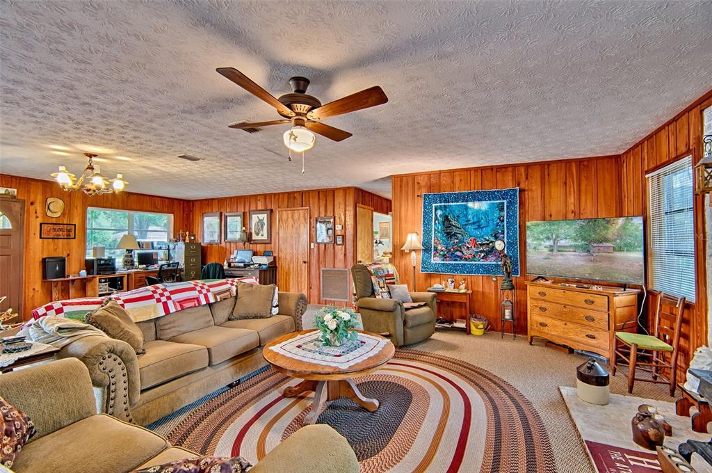 6537 Triest Avenue Keystone Heights, FL 32656 - Photo 7 of 36 a living room with furniture and a large window