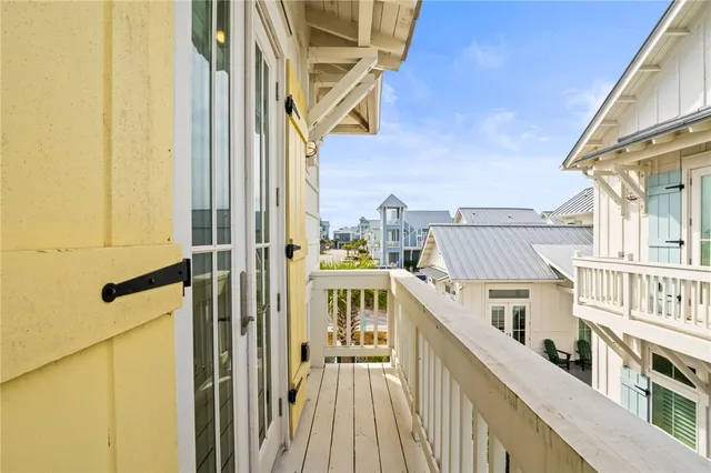 a view of a balcony with wooden floor