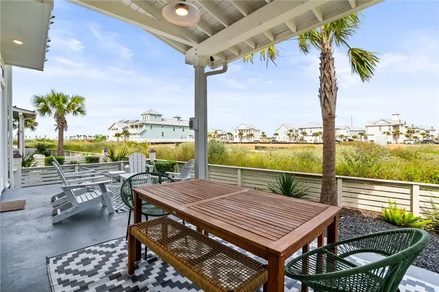 a view of an outdoor sitting area with furniture