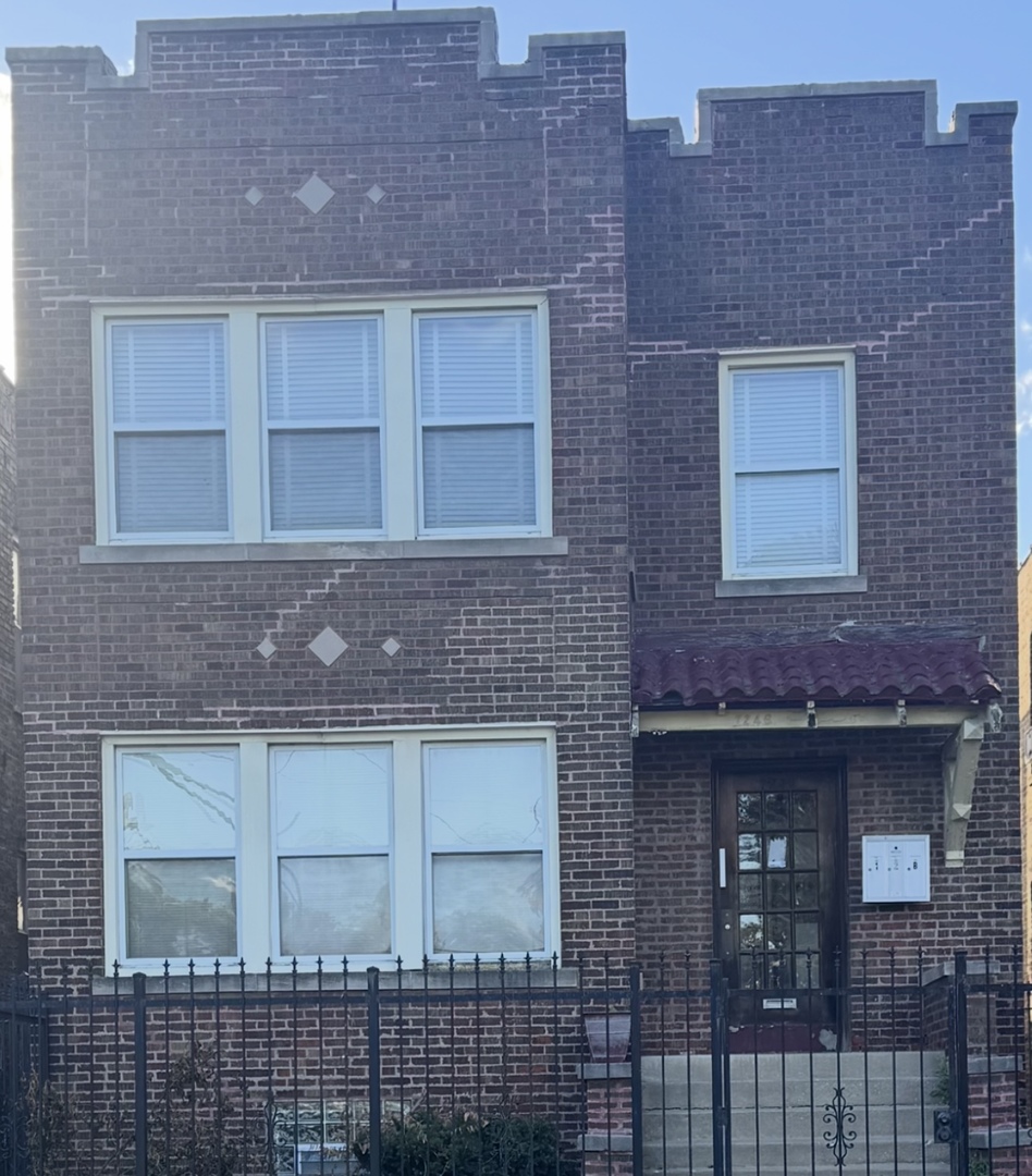 7246 South East End Avenue Chicago, IL 60649 - Photo 1 of 1 a building with a door and a door