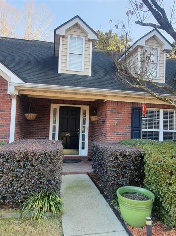 2431 Apalachee Run Way Dacula, GA 30019 - Photo 2 of 17 a view of a house with a small yard and plants