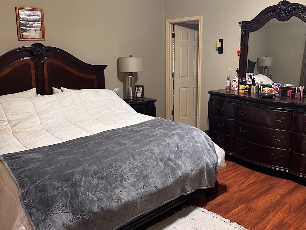 2431 Apalachee Run Way Dacula, GA 30019 - Photo 7 of 17 a bedroom with a bed and a dresser