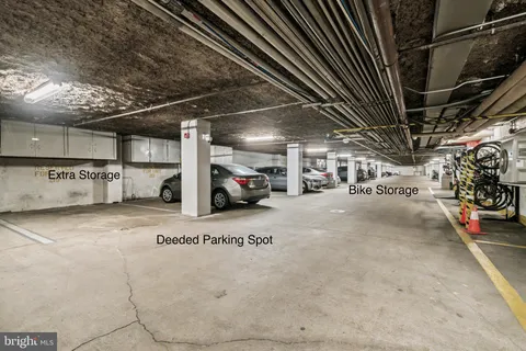 a view of parking garage with cars
