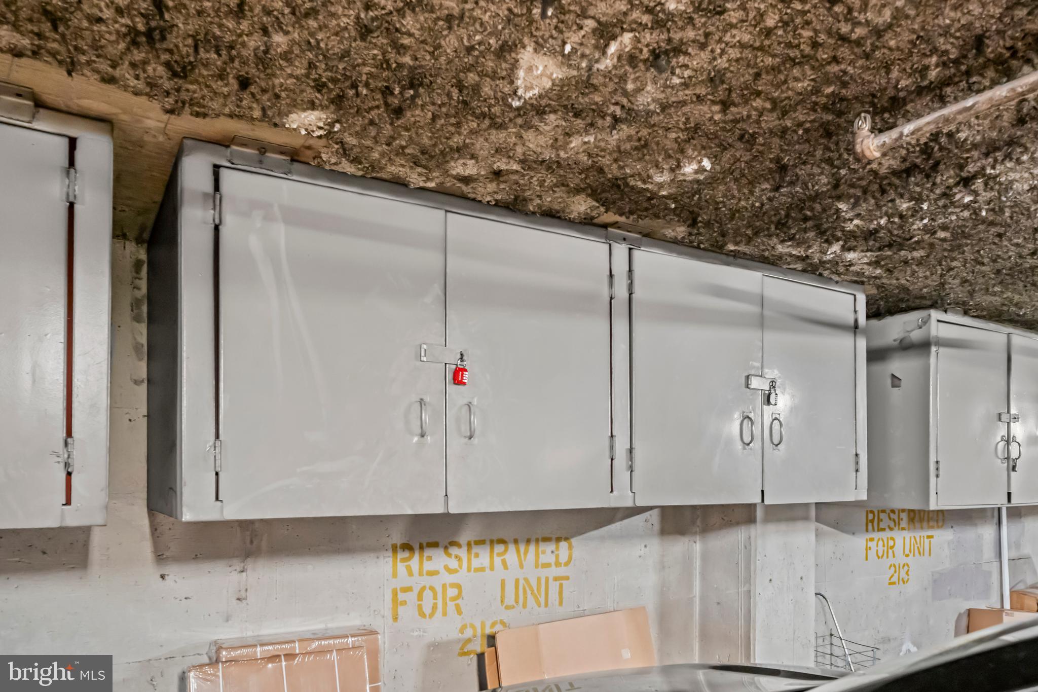 3225 Grace Street Northwest, Unit 219 Washington, DC 20007 - Photo 36 of 45 a kitchen with cabinets and window