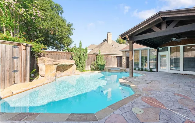 an aerial view of city and swimming pool