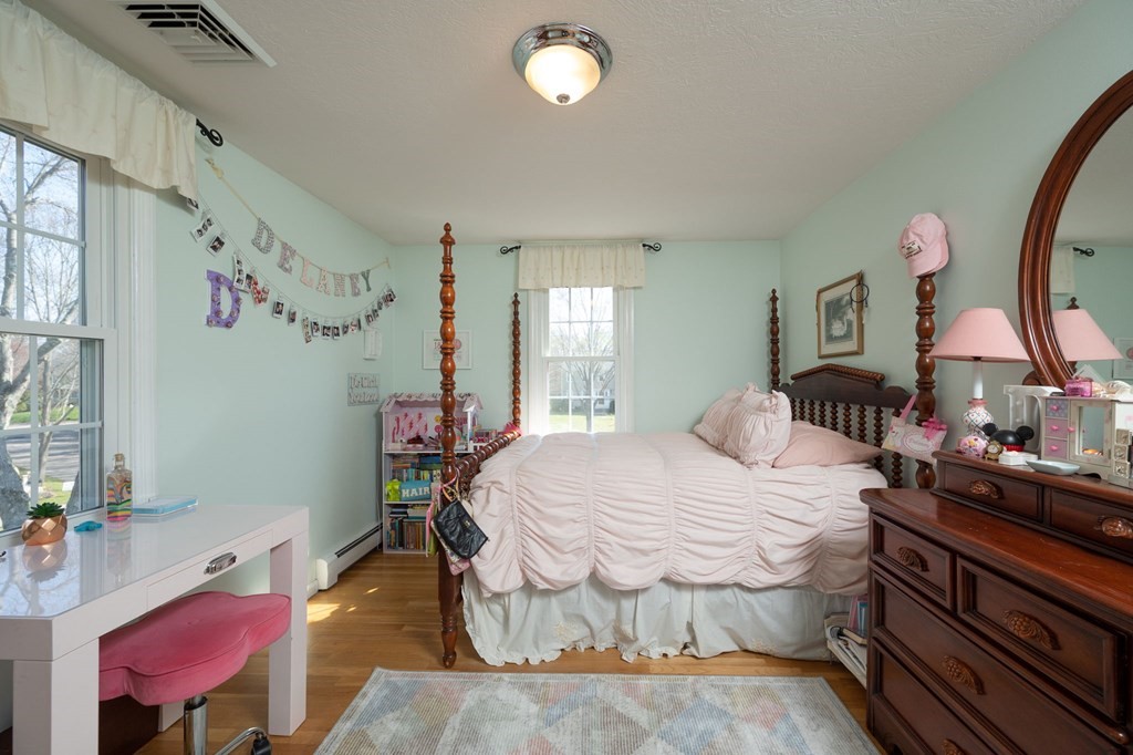 5 Chatham Circle Hingham, MA 02043 - Photo 16 of 30 a bedroom with a bed and a mirror