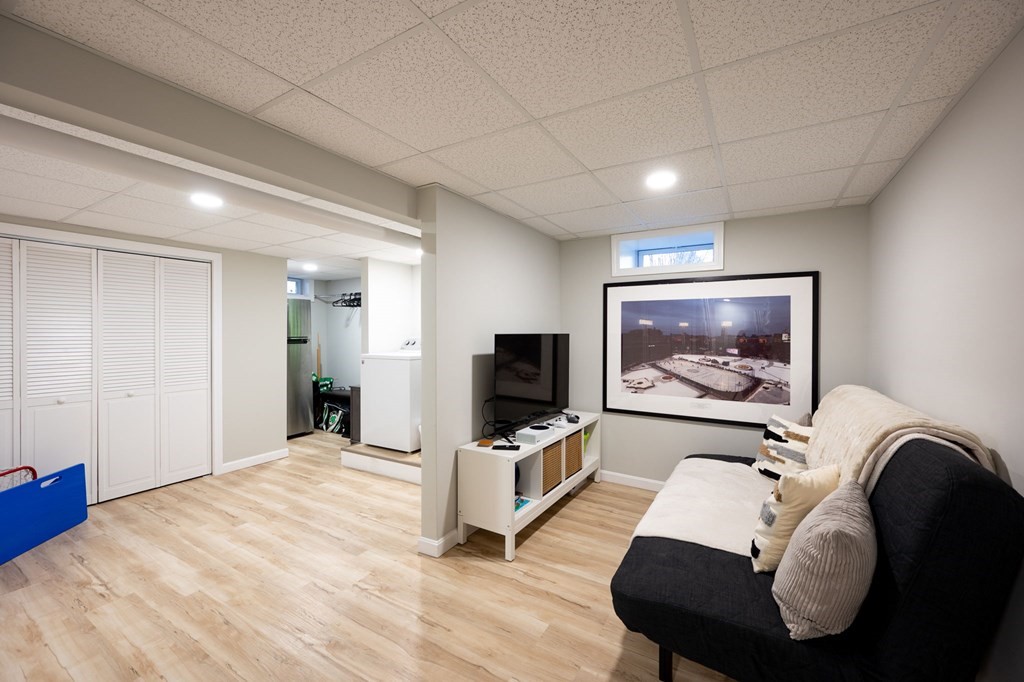 5 Chatham Circle Hingham, MA 02043 - Photo 17 of 30 a living room with furniture and a flat screen tv
