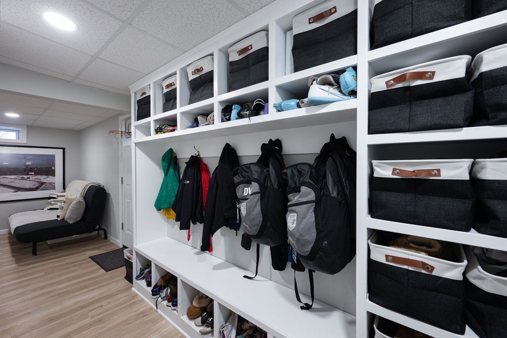 5 Chatham Circle Hingham, MA 02043 - Photo 26 of 30 a view of walk in closet with clothes and shoes