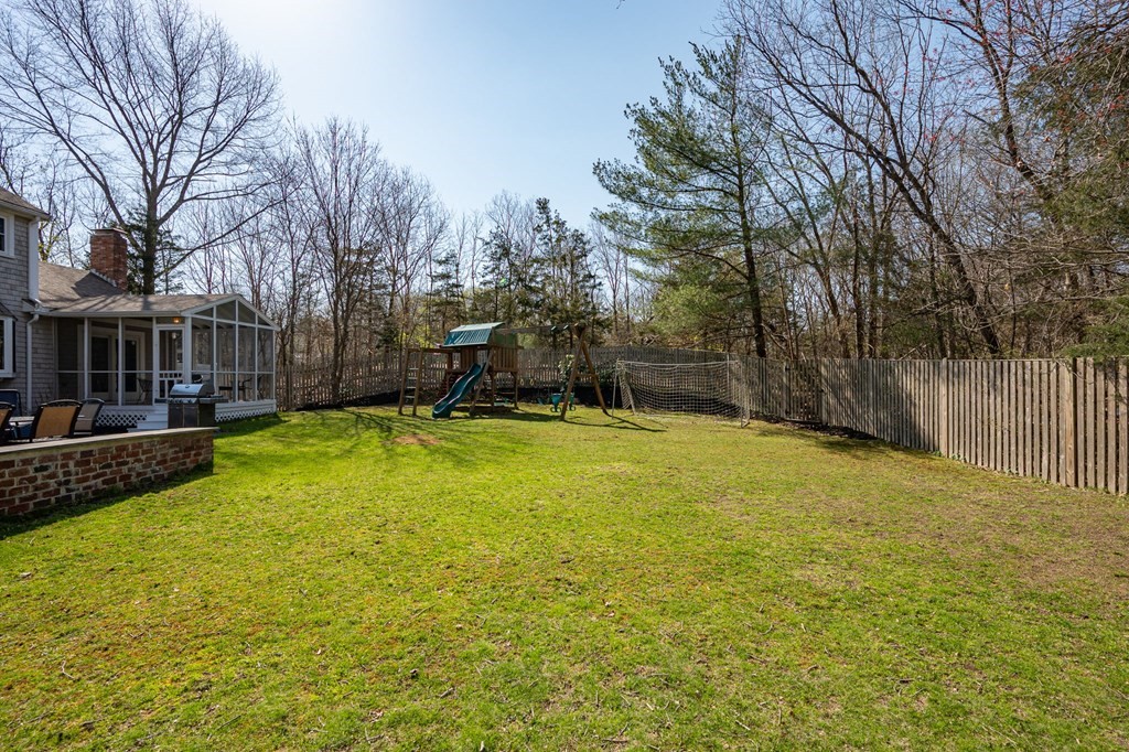 5 Chatham Circle Hingham, MA 02043 - Photo 29 of 30 a view of a backyard with a small cabin