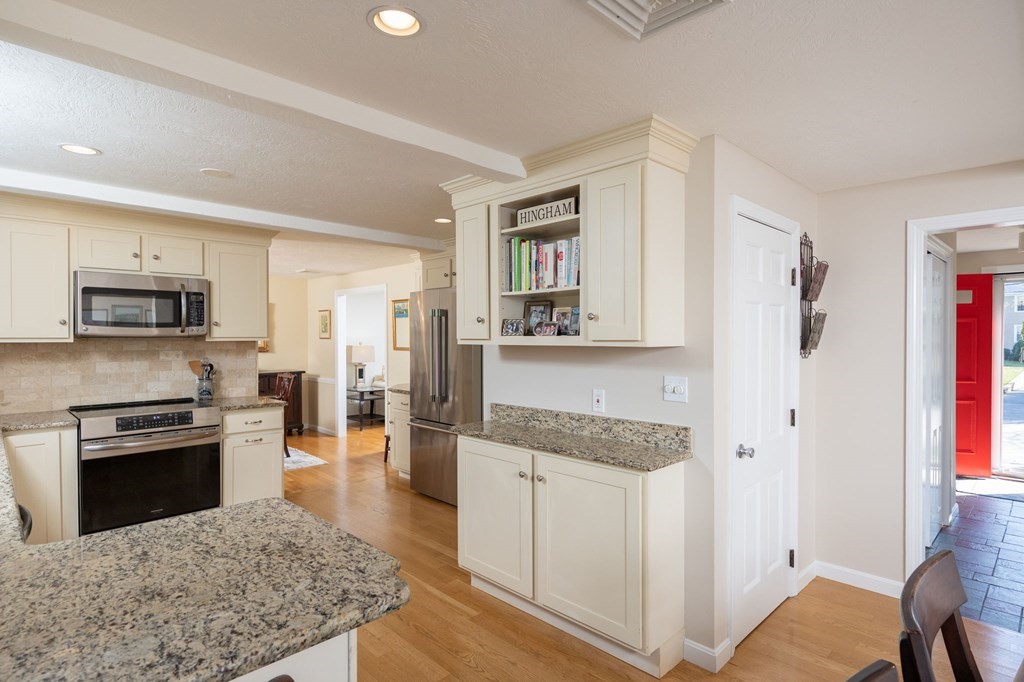 5 Chatham Circle Hingham, MA 02043 - Photo 5 of 30 a kitchen with stainless steel appliances granite countertop a lot of counter space and wooden floor