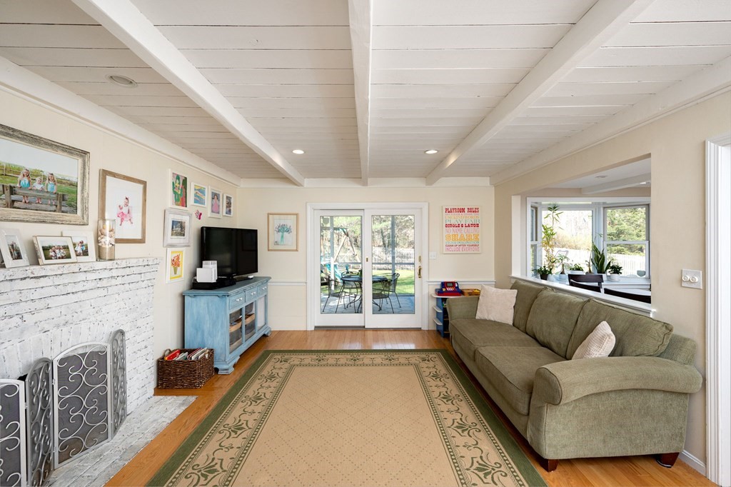 5 Chatham Circle Hingham, MA 02043 - Photo 8 of 30 a living room with fireplace furniture and a flat screen tv