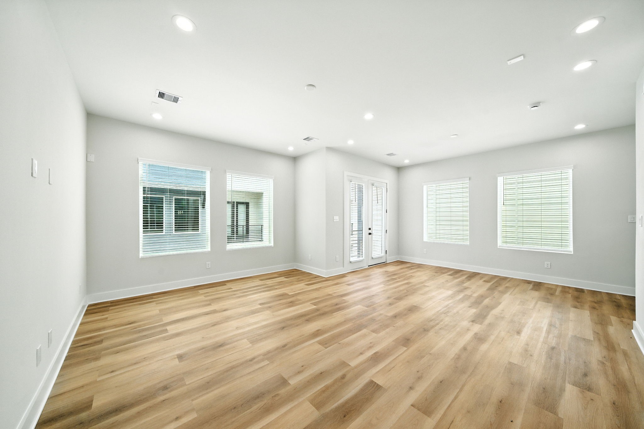2306 Hoskins Drive, Unit B Houston, TX 77080 - Photo 13 of 27 a view of an empty room with wooden floor and a window