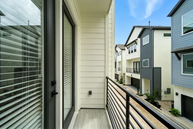 a view of a balcony with a street