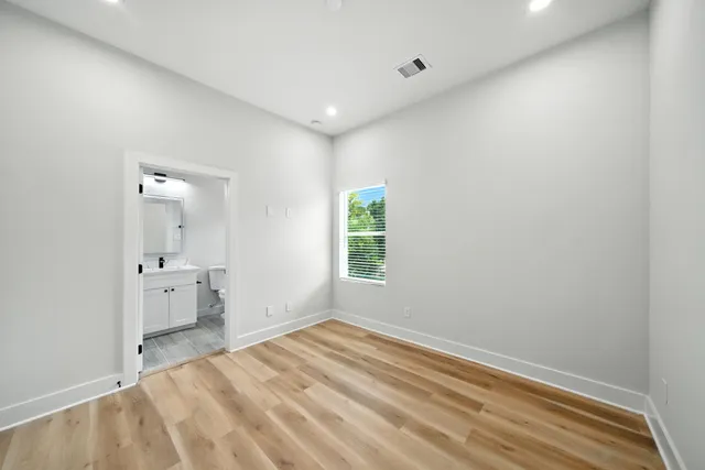 a room with a bed and a window