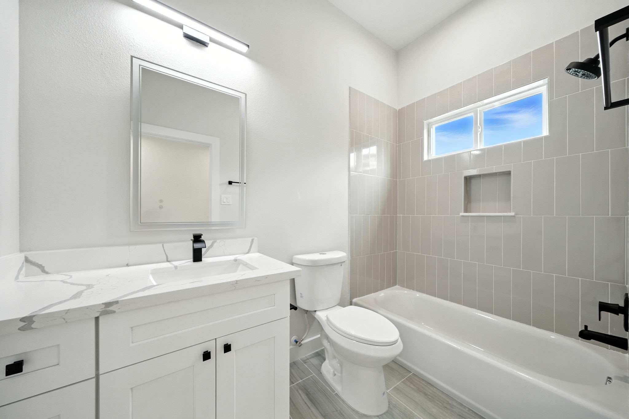 2306 Hoskins Drive, Unit B Houston, TX 77080 - Photo 22 of 27 a bathroom with a sink a toilet and shower