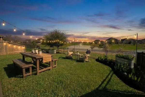 a view of house with a yard