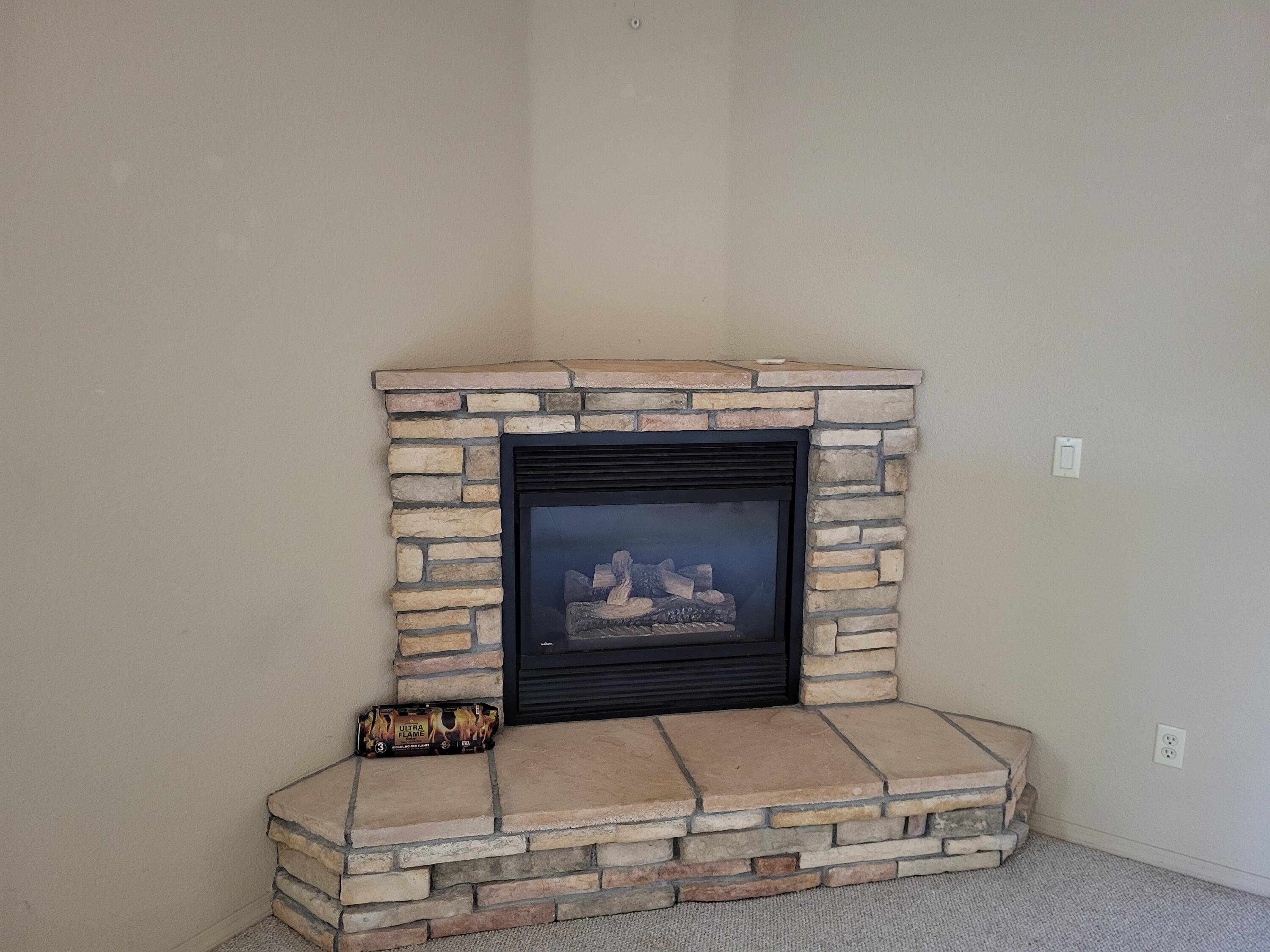 1120 South Sycamore Circle Payson, AZ 85541 - Photo 11 of 44 a living room with furniture and a fireplace