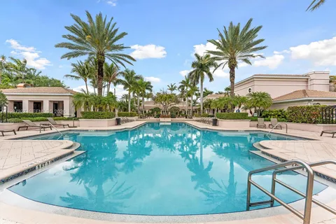 a view of a swimming pool with lounge chair