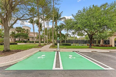 a view of a street with a yard