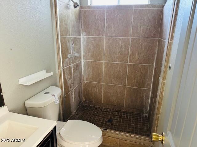 1737 West Pecan Road Phoenix, AZ 85041 - Photo 11 of 14 a bathroom with a toilet and a shower