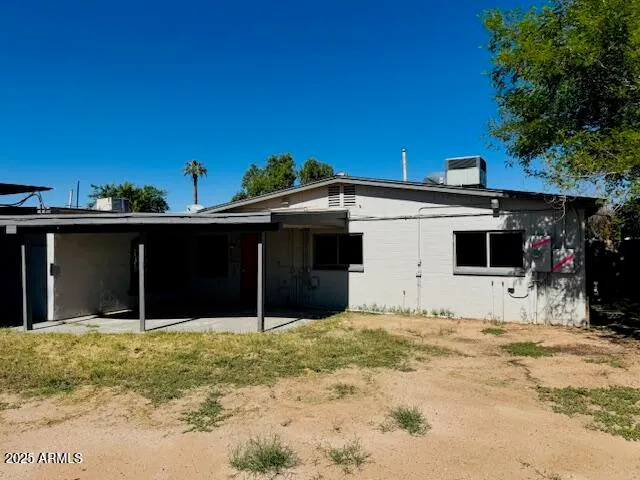 a house with trees in the background
