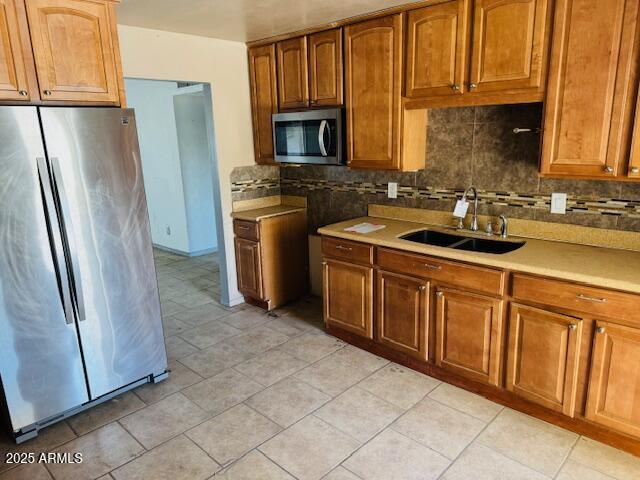 1737 West Pecan Road Phoenix, AZ 85041 - Photo 6 of 14 a kitchen with stainless steel appliances granite countertop a refrigerator stove and sink