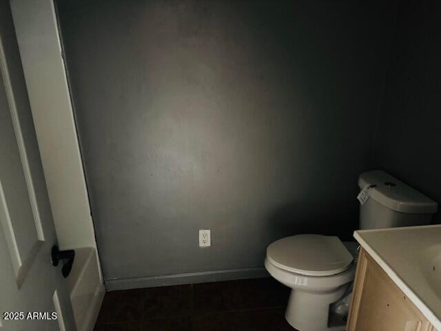 1737 West Pecan Road Phoenix, AZ 85041 - Photo 8 of 14 a white toilet sitting next to a sink