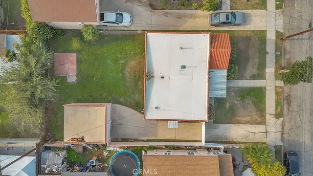 an aerial view of a house with outdoor space