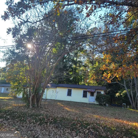 a view of a house and a yard