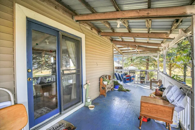 a view of balcony with furniture