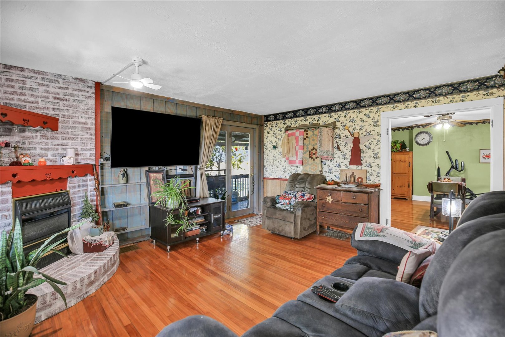 23 County Road 300 North Ivesdale, IL 61851 - Photo 19 of 45 a living room with furniture and a flat screen tv