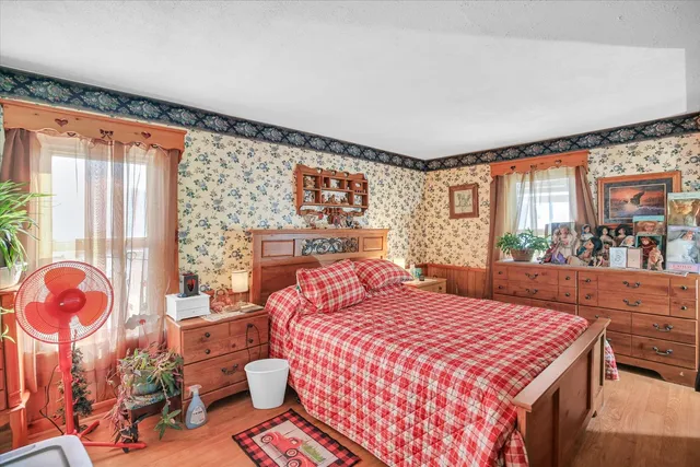 a bedroom with a bed and a dresser
