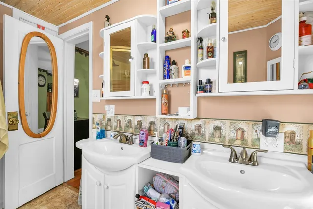 a kitchen that has a sink and a stove in it