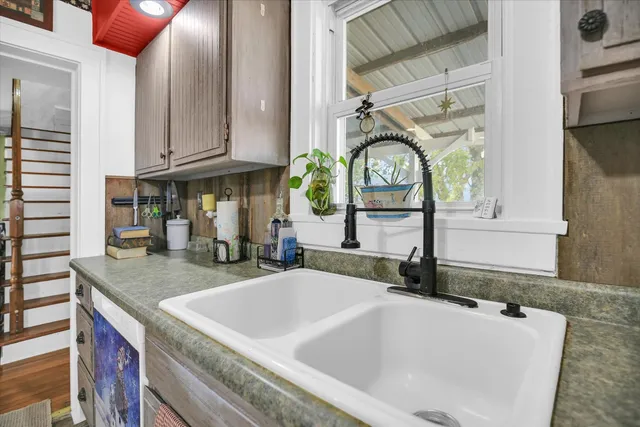 a bedroom with a bed and a chair