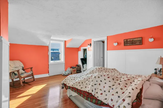 a living room with furniture gym equipment and a window