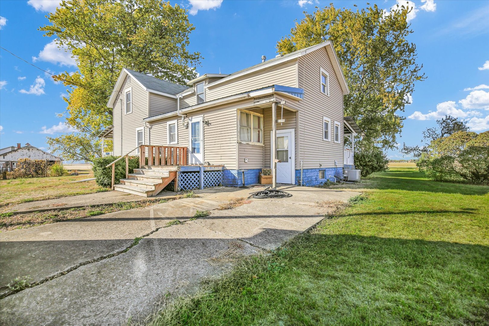 23 County Road 300 North Ivesdale, IL 61851 - Photo 8 of 45 a view of a white house with a big yard and large tree