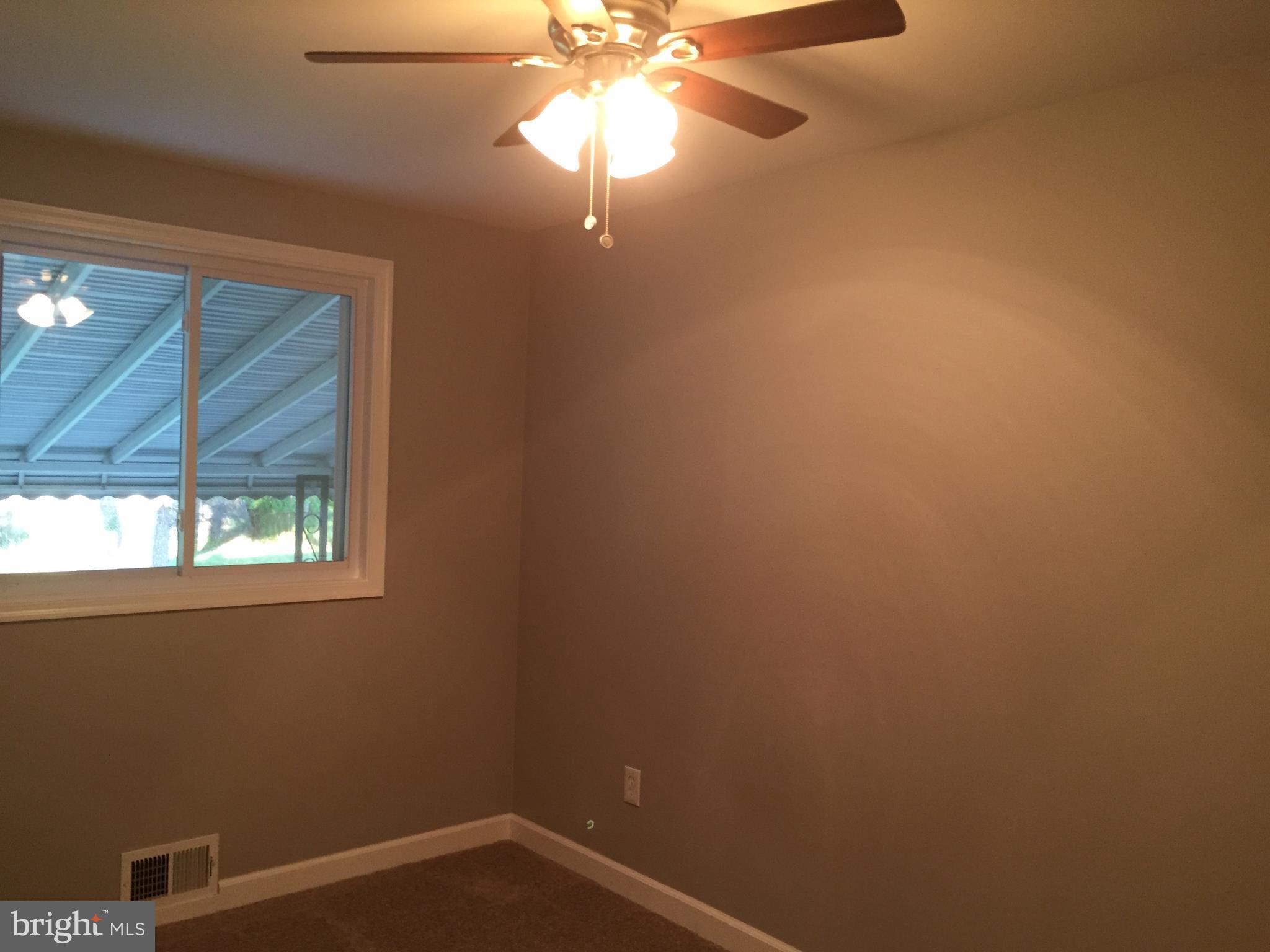3157 Jeffland Road Baltimore, MD 21244 - Photo 14 of 19 an empty room with windows and fan
