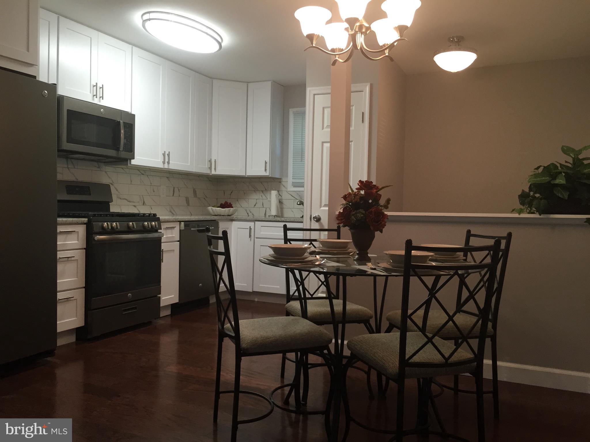 3157 Jeffland Road Baltimore, MD 21244 - Photo 5 of 19 a view of a dining room with furniture and wooden floor