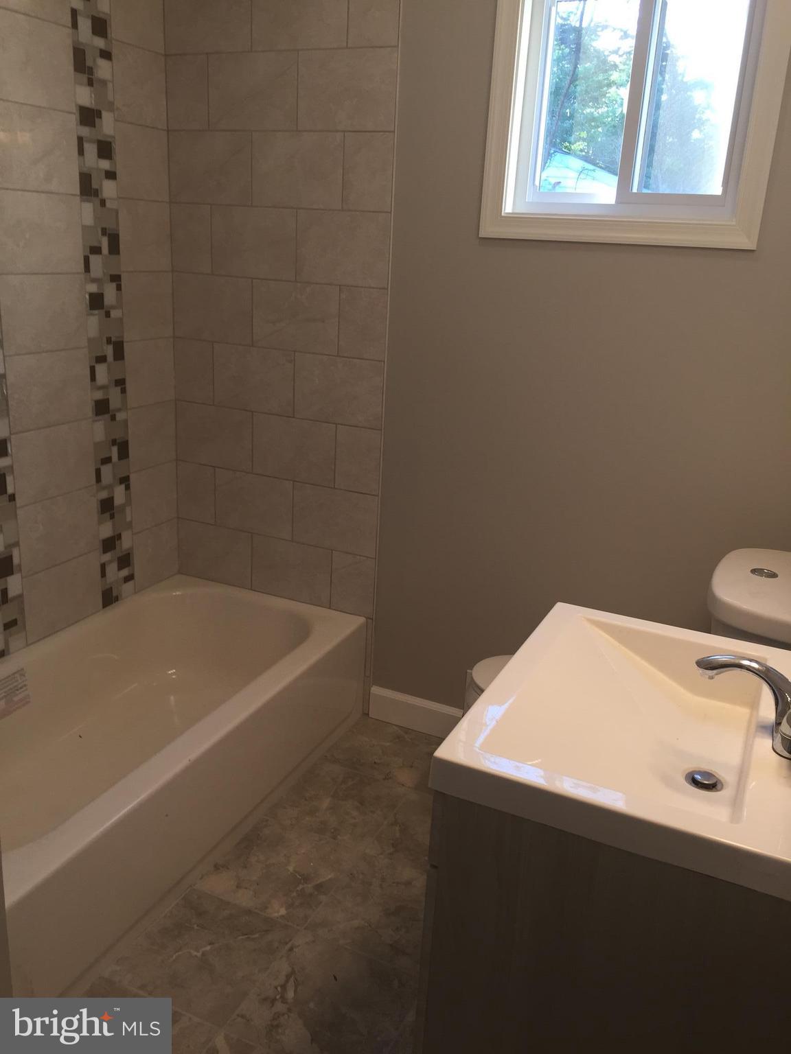3157 Jeffland Road Baltimore, MD 21244 - Photo 10 of 19 a bathroom with a sink and a bathtub