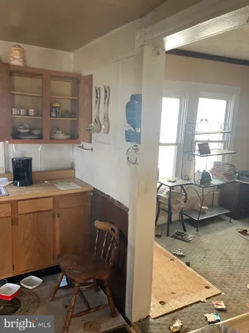a kitchen with a sink and wooden cabinets
