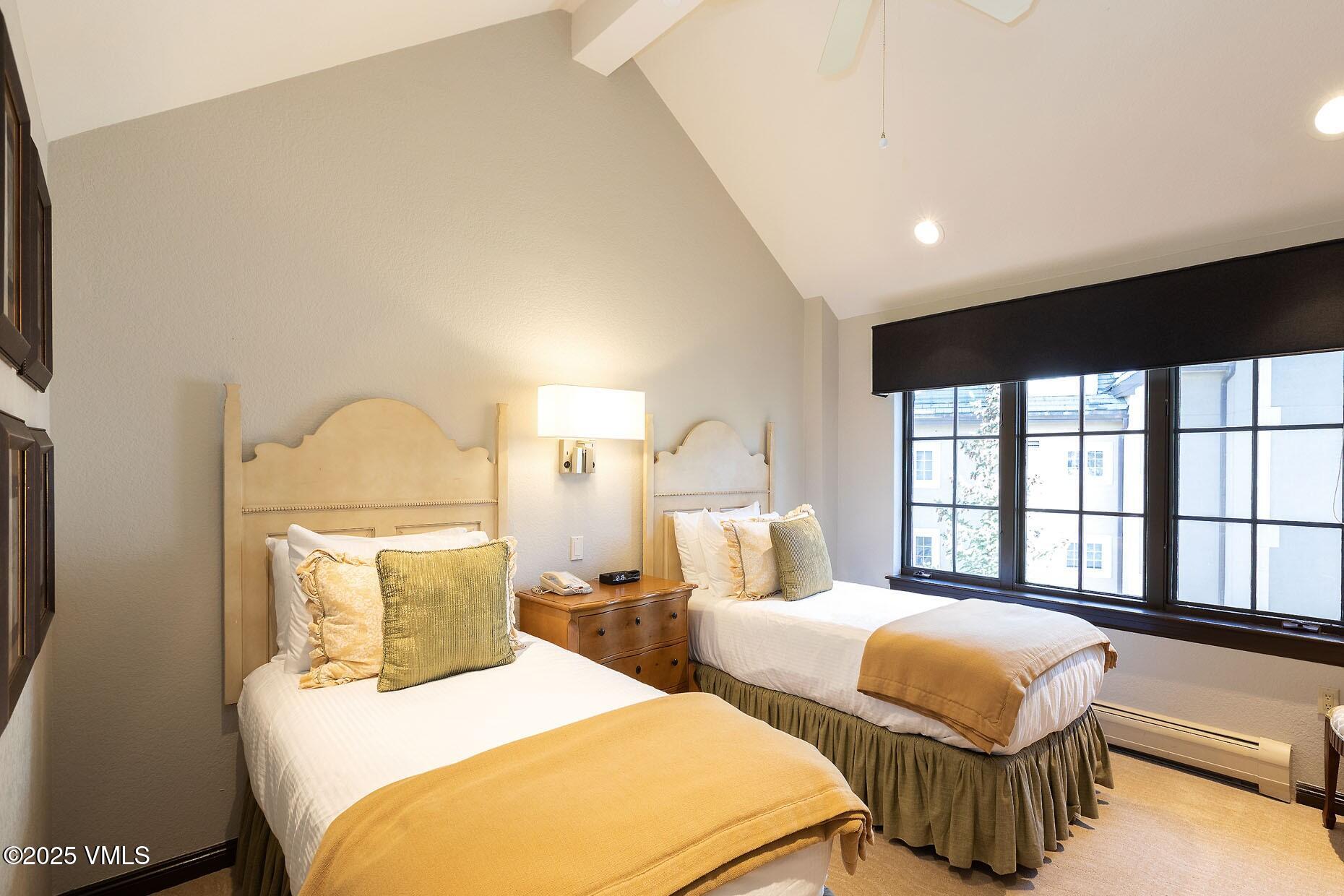 210 Offerson Road, Unit 3044 Beaver Creek, CO 81620 - Photo 12 of 21 a bedroom with two beds and a large window