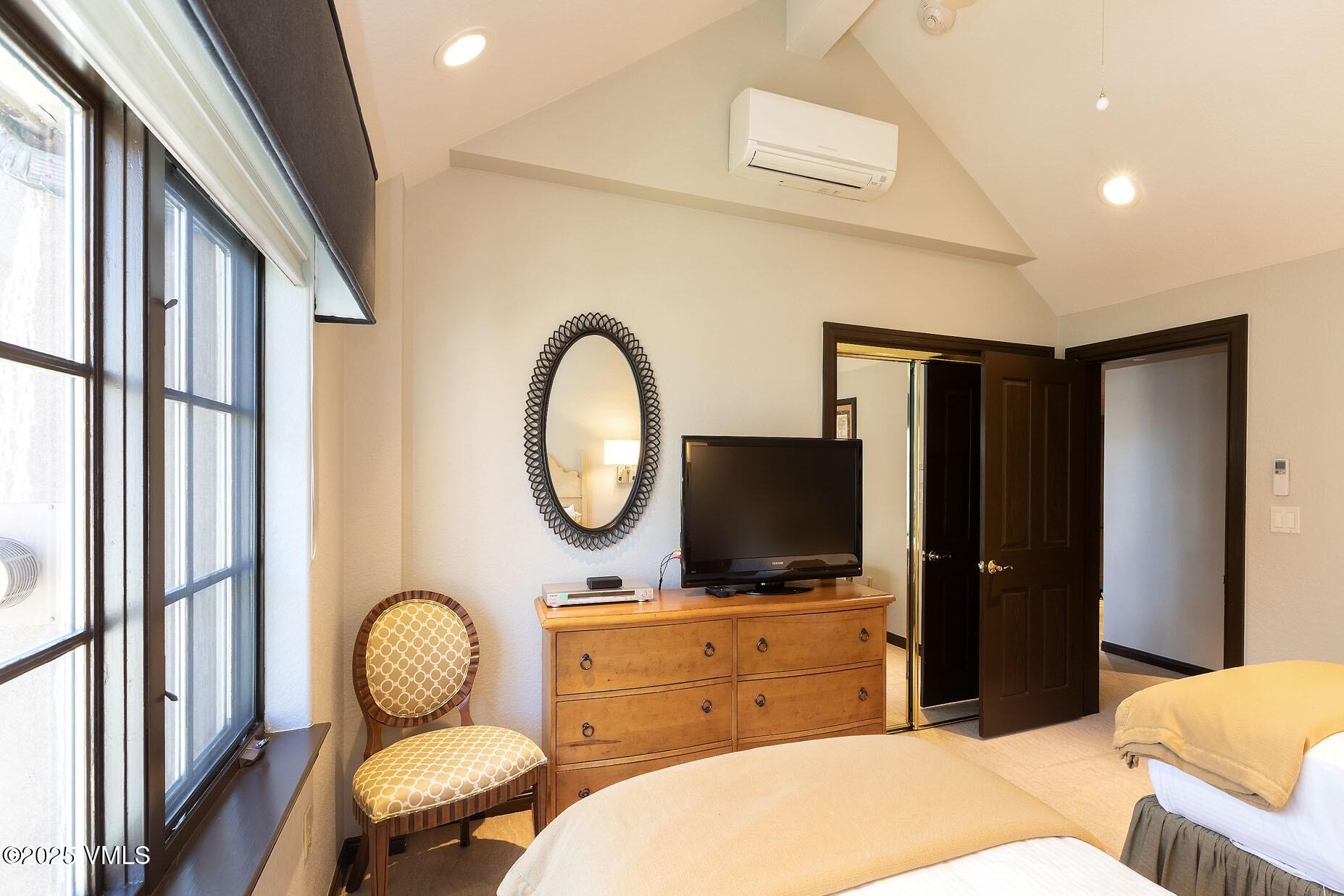 210 Offerson Road, Unit 3044 Beaver Creek, CO 81620 - Photo 13 of 21 a bedroom with a bed and a flat screen tv