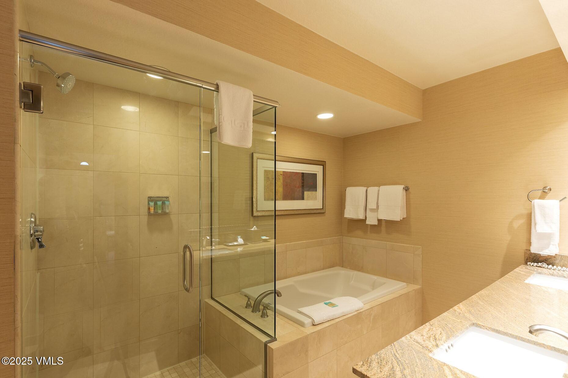 210 Offerson Road, Unit 3044 Beaver Creek, CO 81620 - Photo 15 of 21 a bathroom with a sink and shower