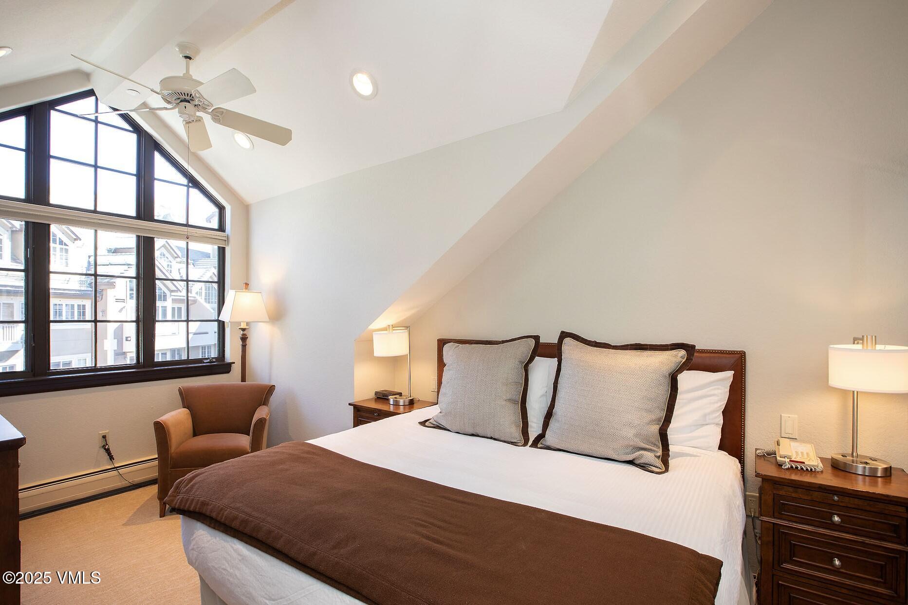 210 Offerson Road, Unit 3044 Beaver Creek, CO 81620 - Photo 18 of 21 a bedroom with a bed and a lamp on dresser