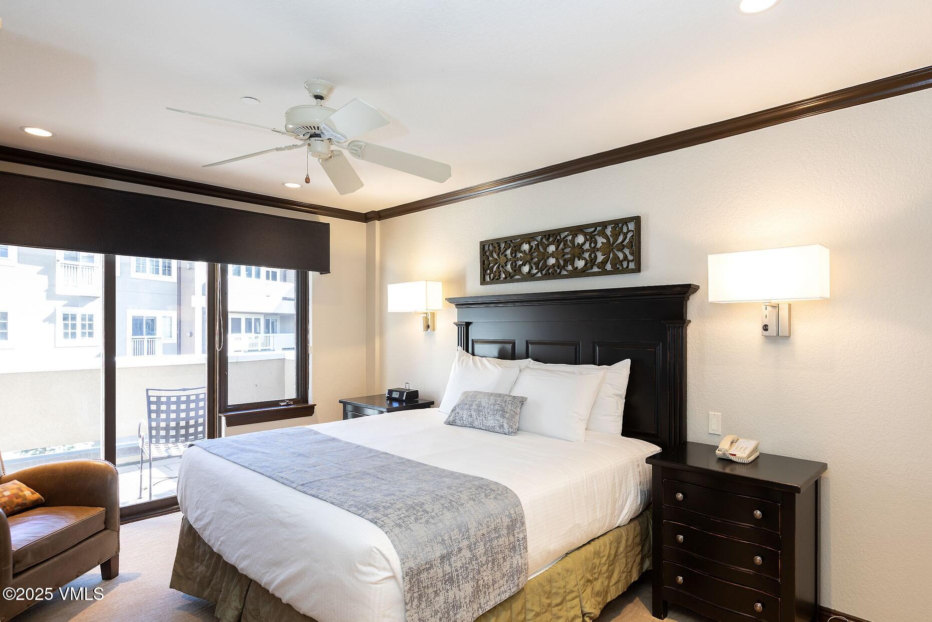 210 Offerson Road, Unit 3044 Beaver Creek, CO 81620 - Photo 8 of 21 a bedroom with a bed and wooden floor