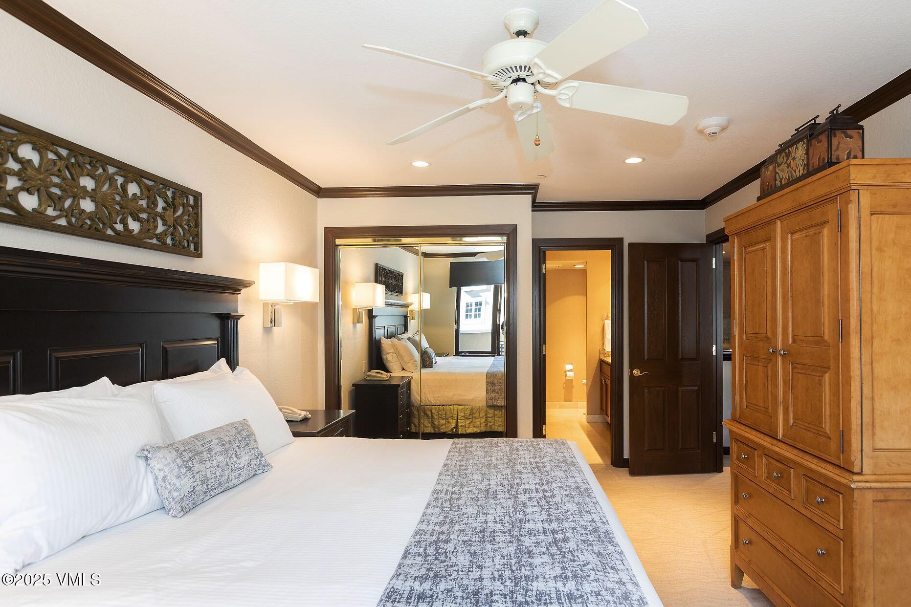 210 Offerson Road, Unit 3044 Beaver Creek, CO 81620 - Photo 9 of 21 a bedroom with a bed and a walk in closet