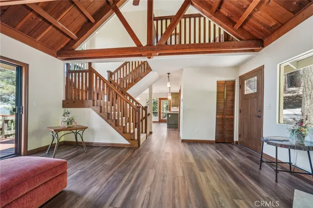 a view of entryway dining room and hall with wooden floor